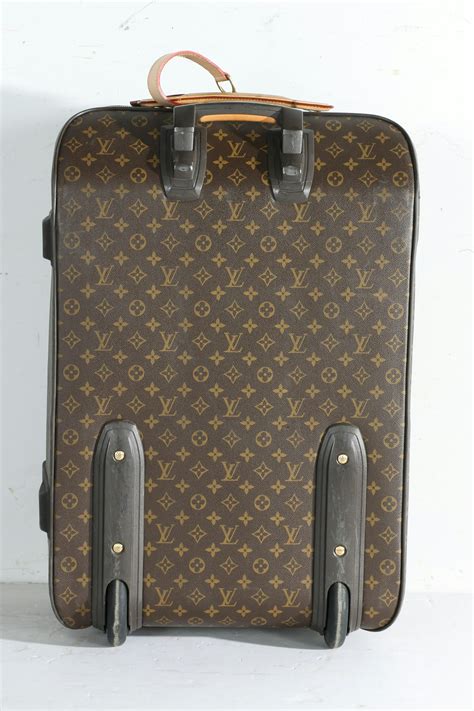 louis vuitton bag with trolley sleeve|louis vuitton rolling suitcase.